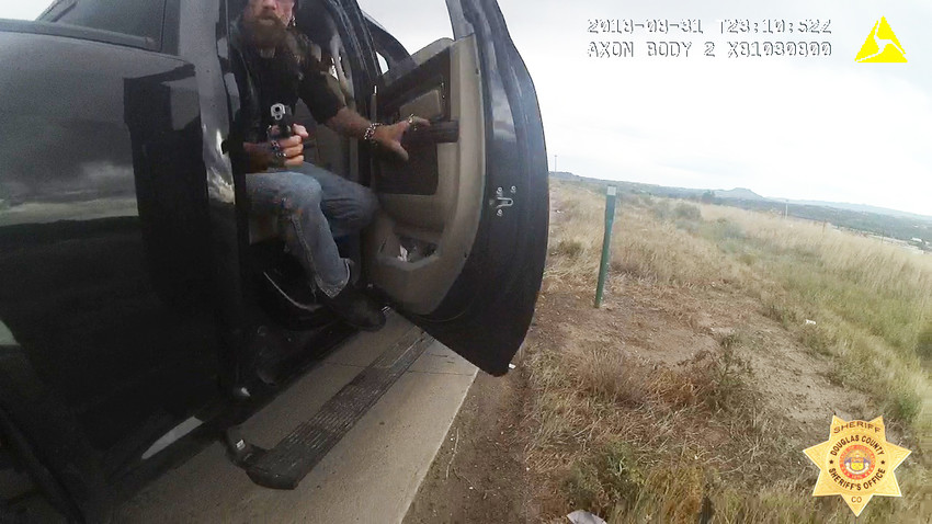 Body camera footage shows a suspect pointing a gun at deputies on Aug. 31.